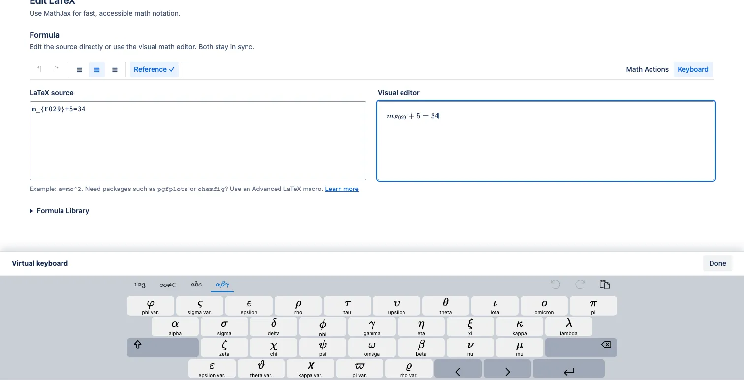 The Greek virtual-keyboard layout docked to the bottom of the editor